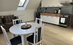 Podkrovní apartmán se společným bazénem